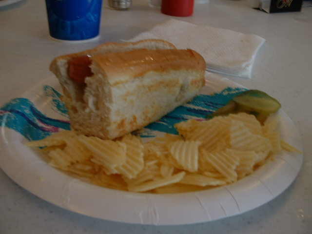 a plate that has some chips and a piece of cake on it