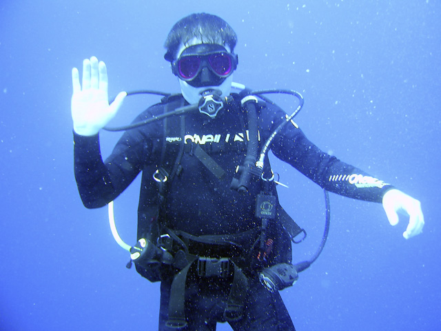 a man in diving gear posing for the camera