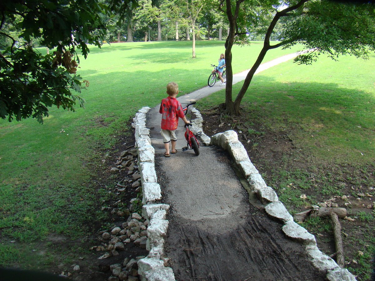 a  walking up a cement pathway