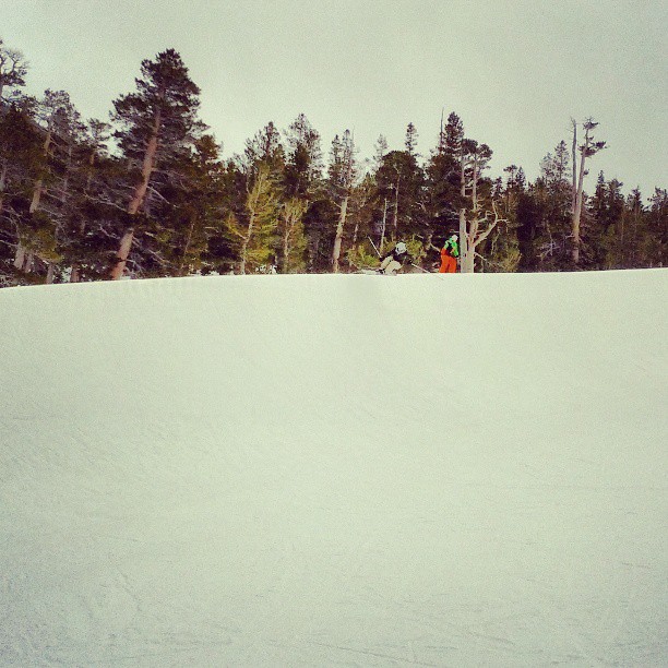 a person riding down a snow covered slope