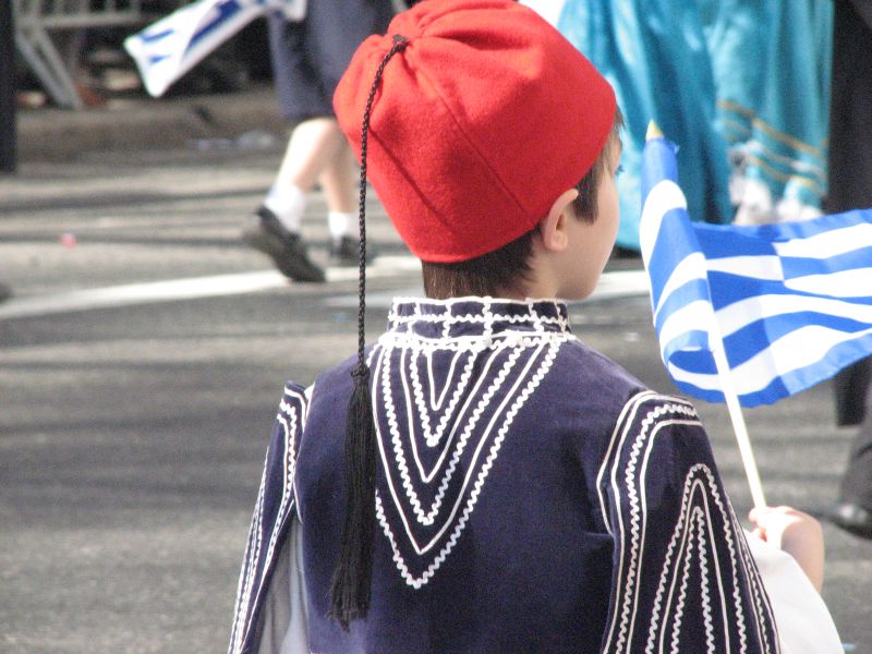 an image of a child that is wearing greek attire