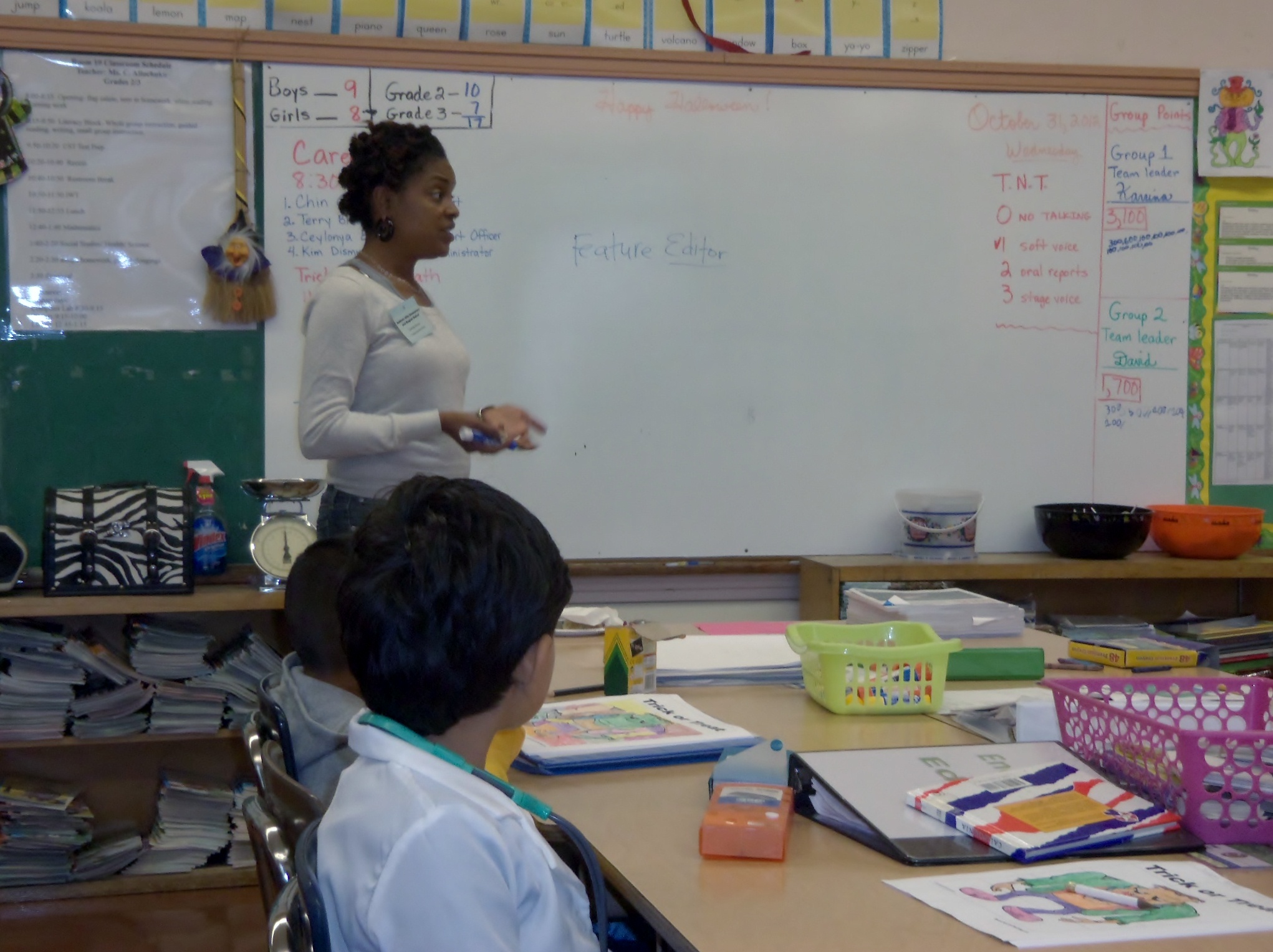 a young black girl giving a lesson in class