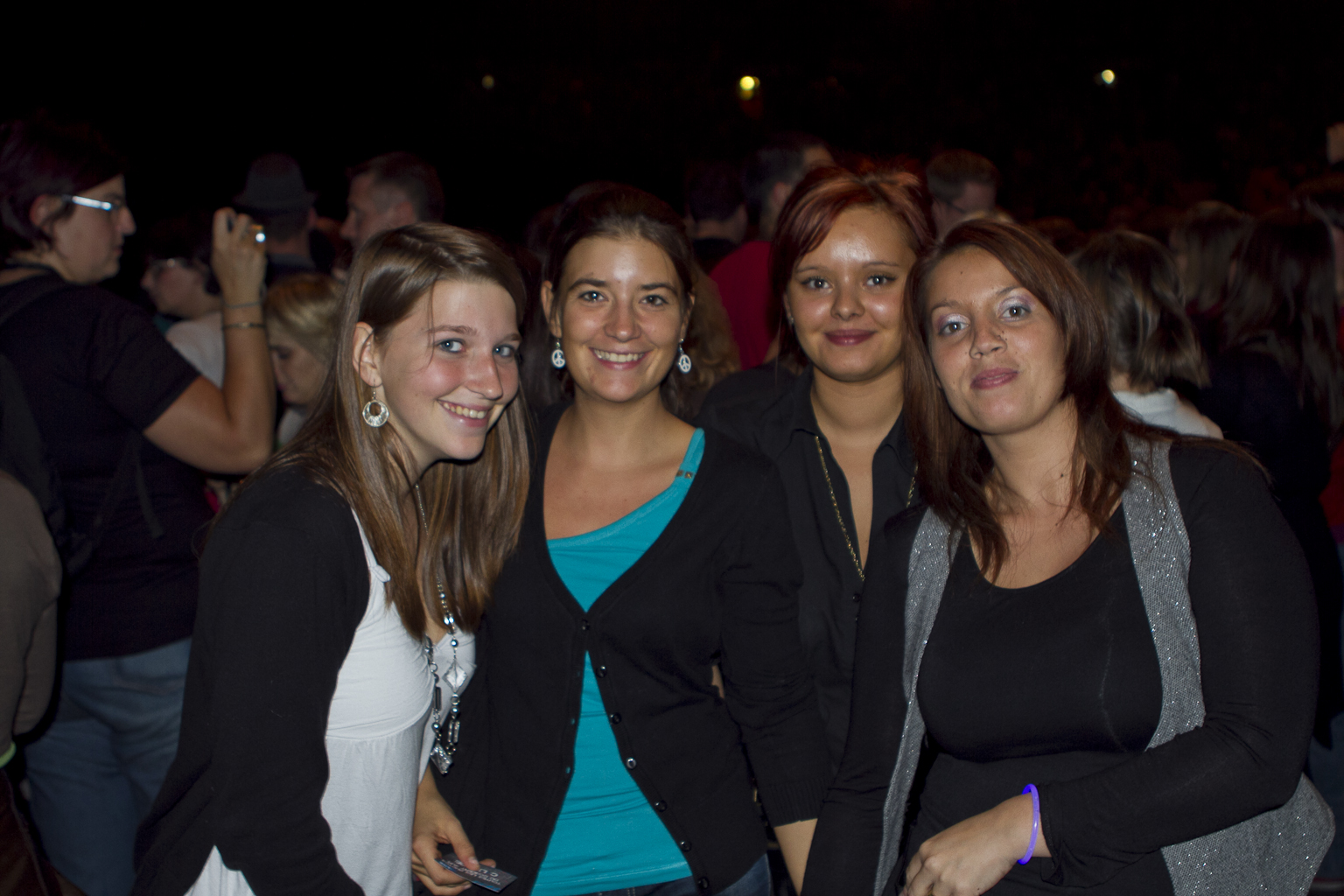 a group of young women posing for the camera