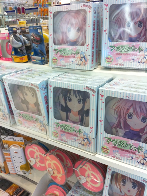 a store shelf filled with anime pictures and merchandise