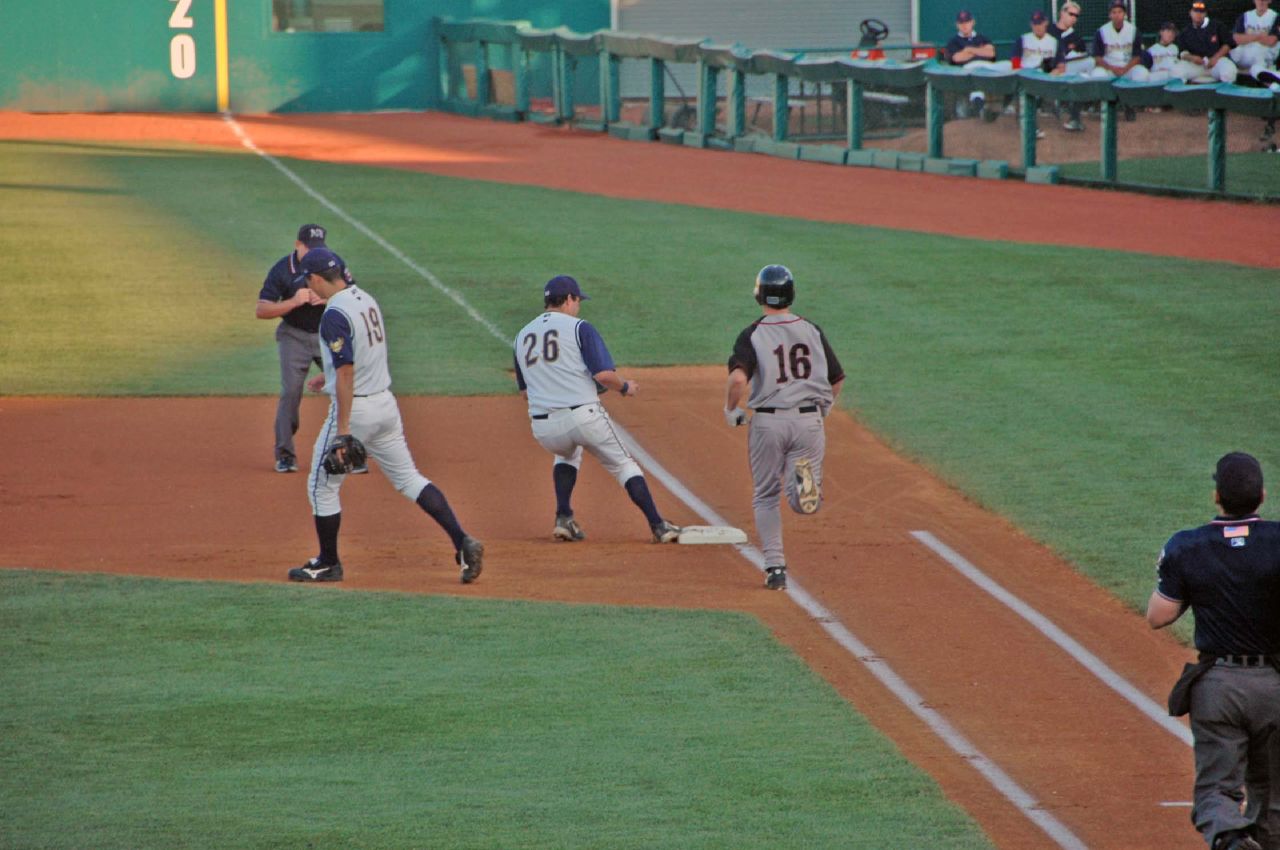 baseball players congratulating each other on the field