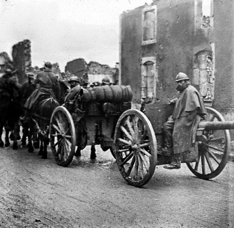 old po of horses and buggies lined up on a road