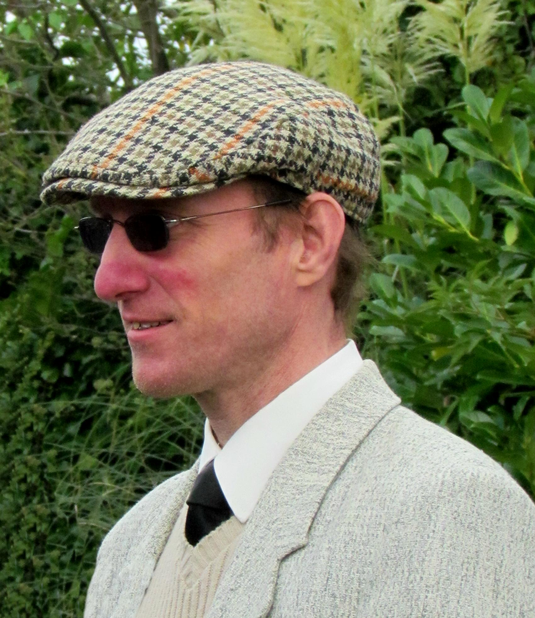 an image of a man wearing glasses and a suit