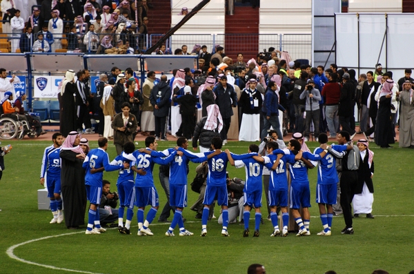 an image of a group of soccer players that are on the field