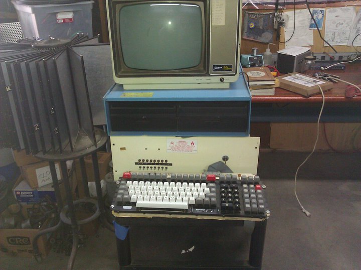 a computer set up next to an old style computer