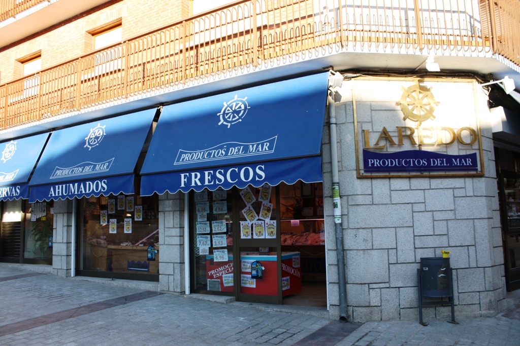 a store front with windows that are closed