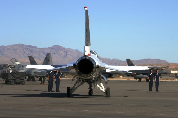 airplanes lined up ready for take off in the desert