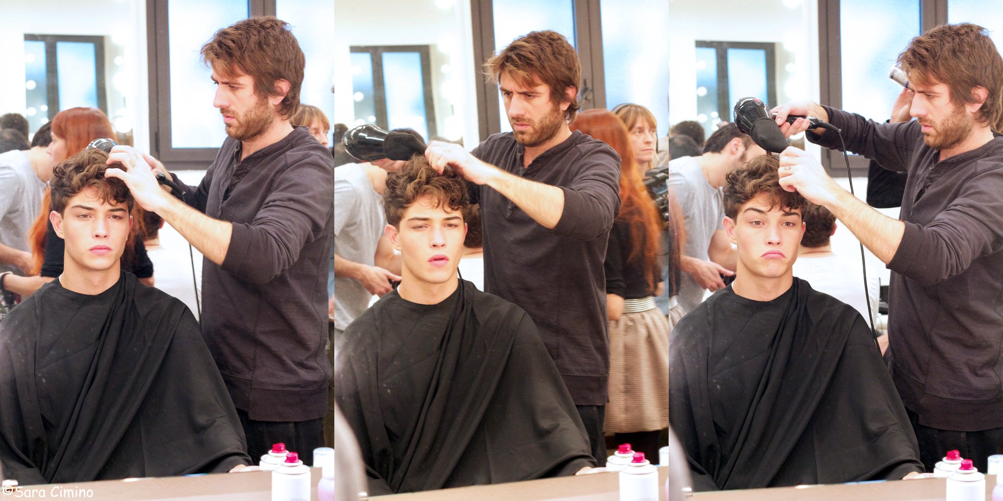 men at table in salon getting their hair cut