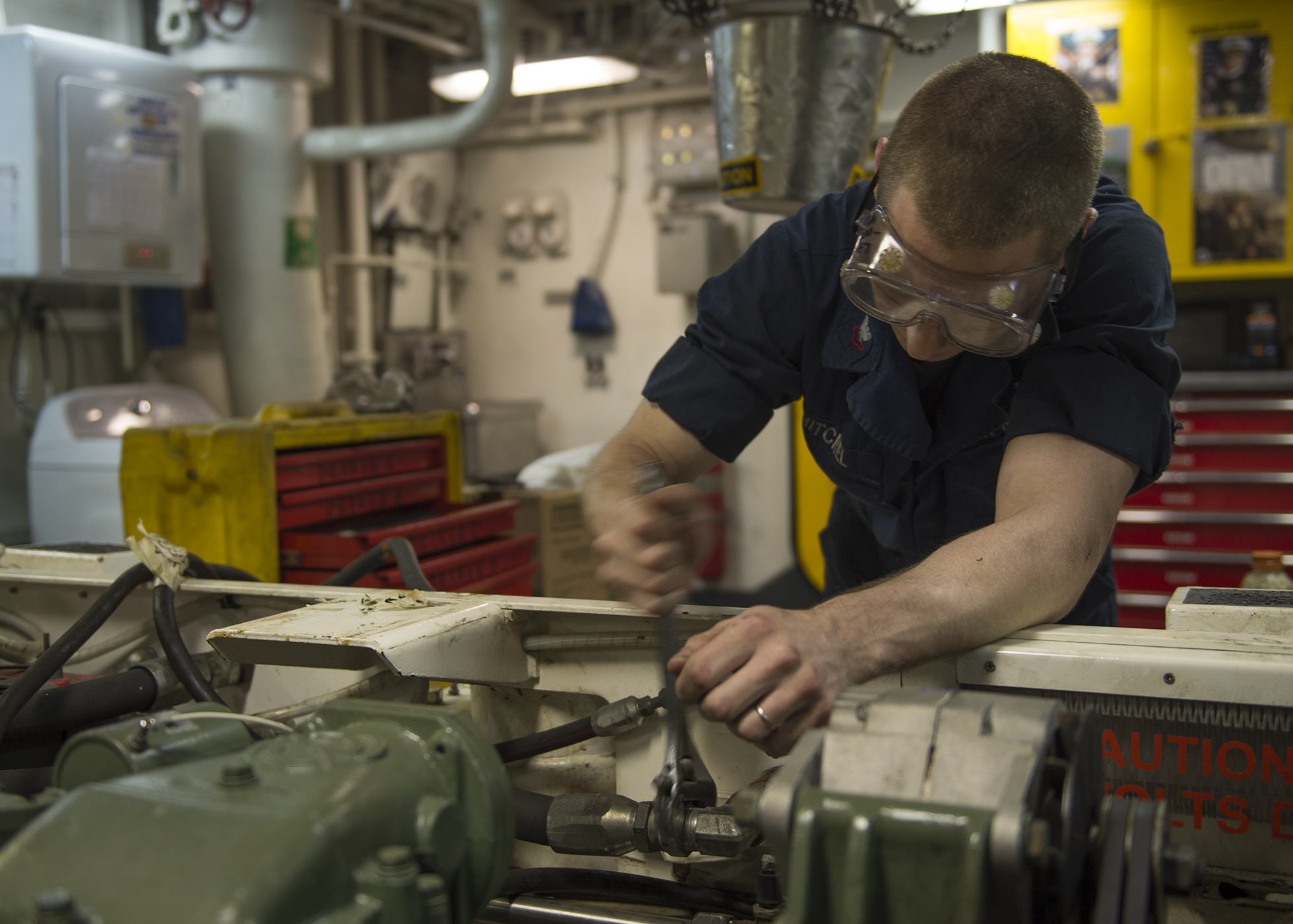 a man working on machine tool in workshop