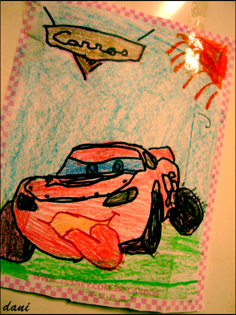 a child's drawing with a red car and a blue sky above