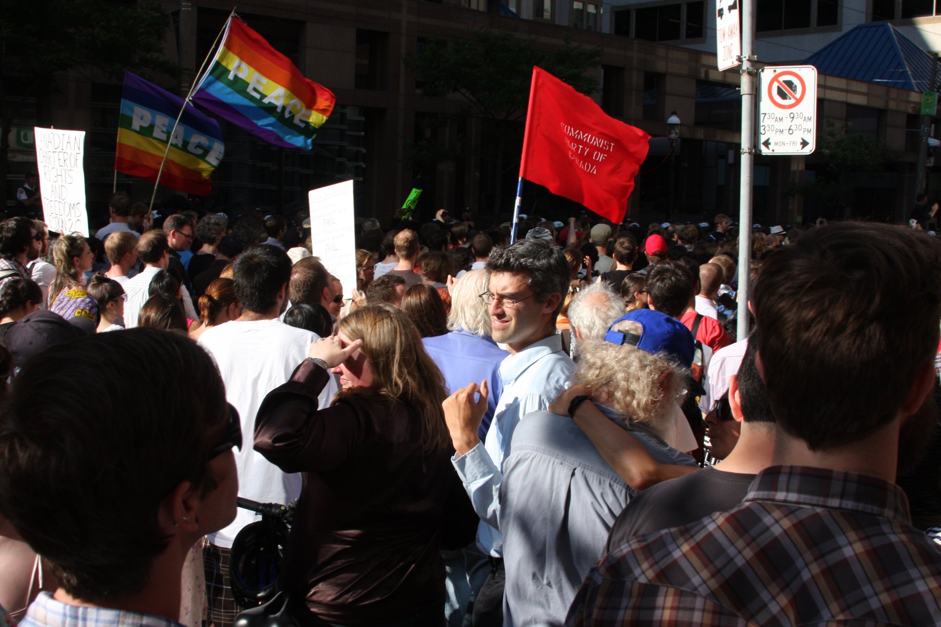 a large crowd gathered around the gay pride parade