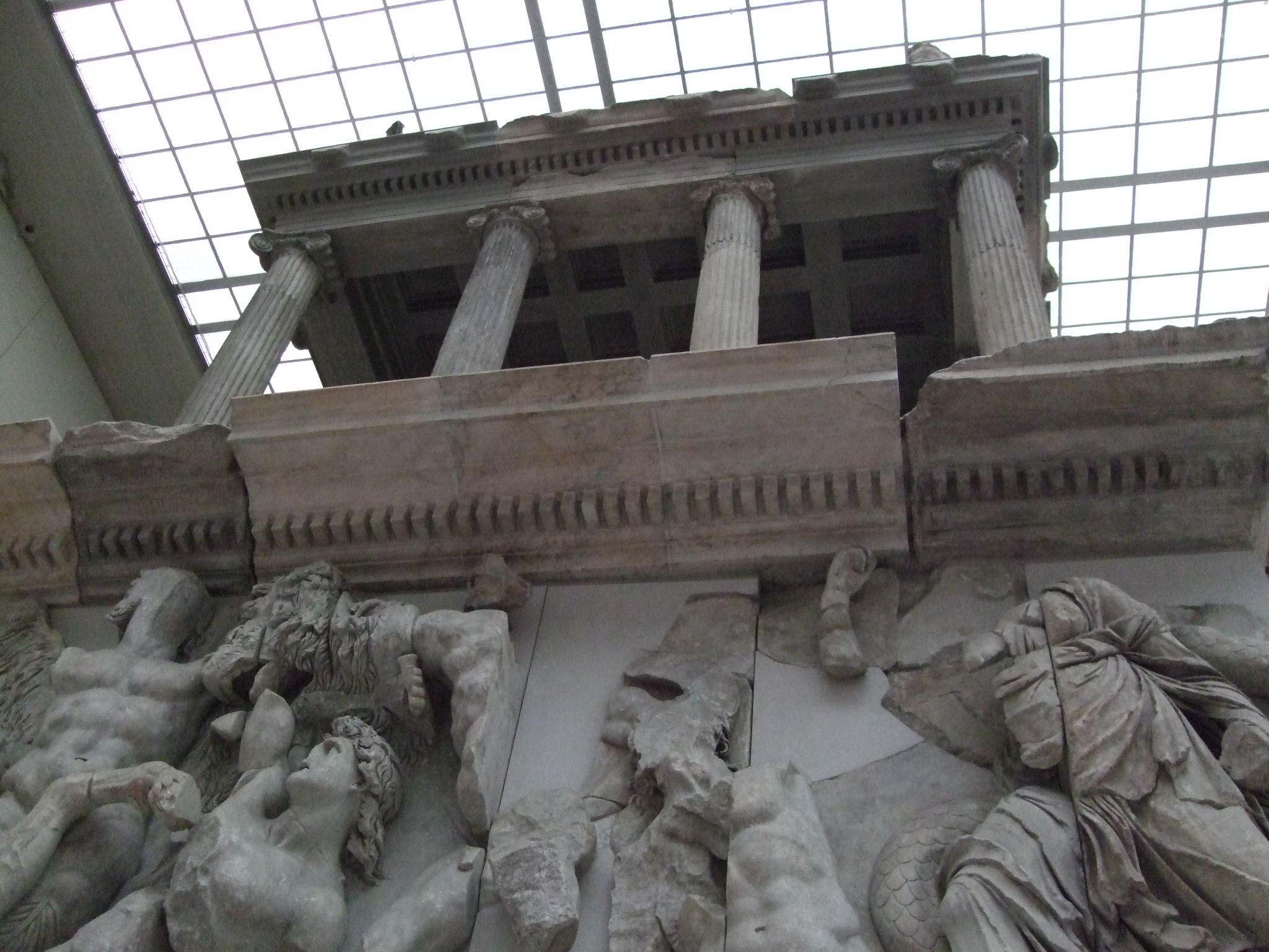 several statues standing on either side of a large building