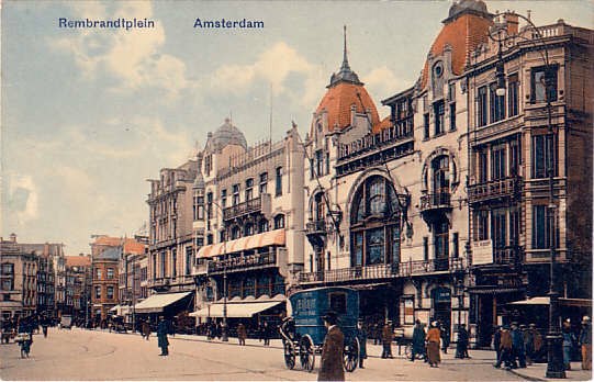 an old po of people and buildings on a street