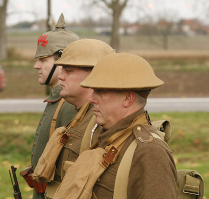 three men in uniforms are walking together