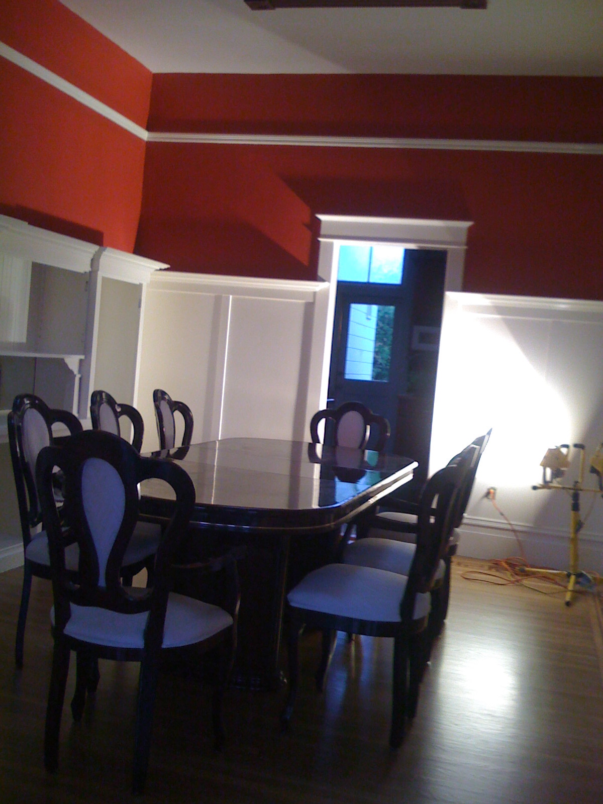 this is the dark colored dining table in this room