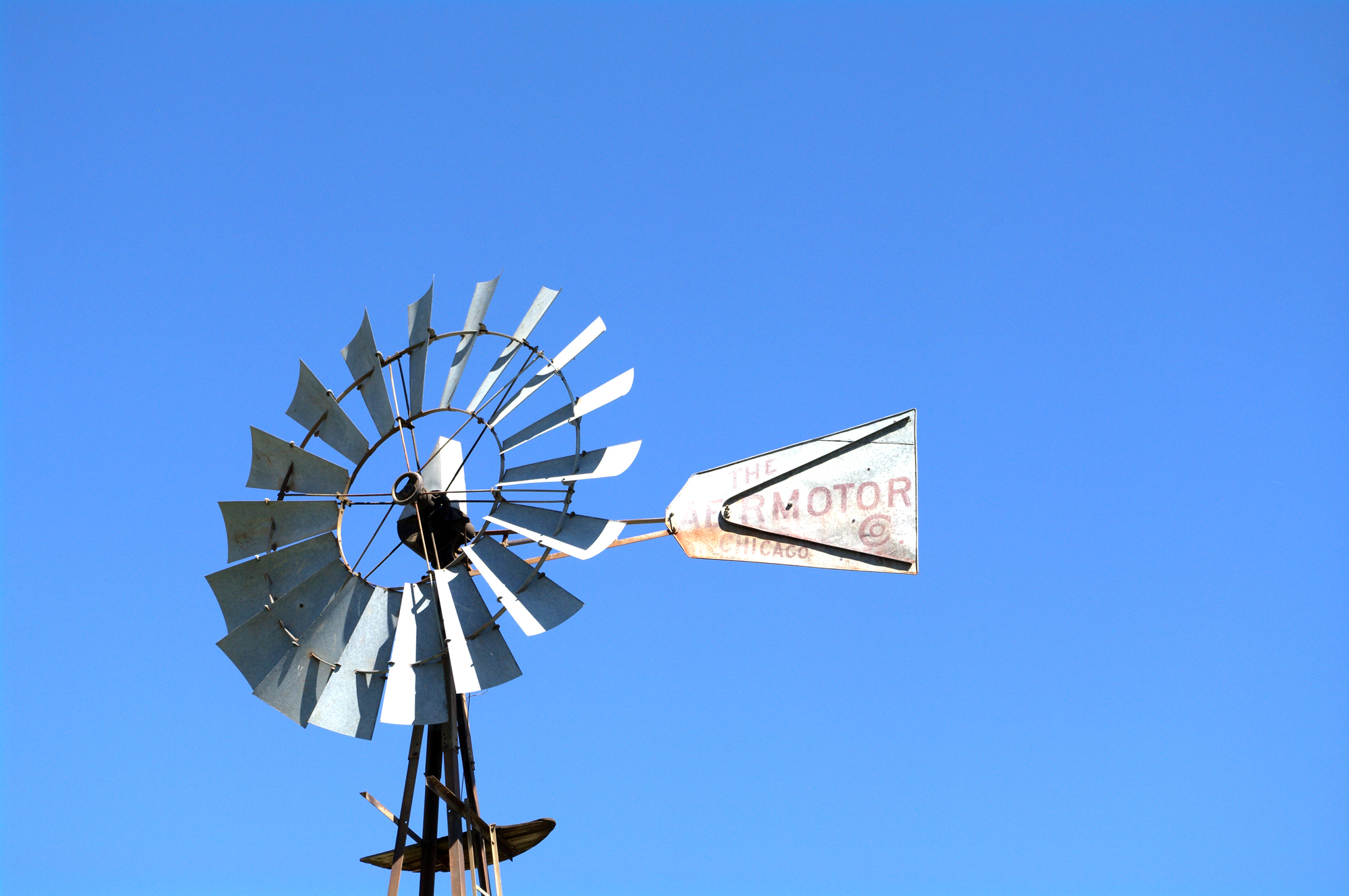 windmill with a wind indicator attached with no wind on it