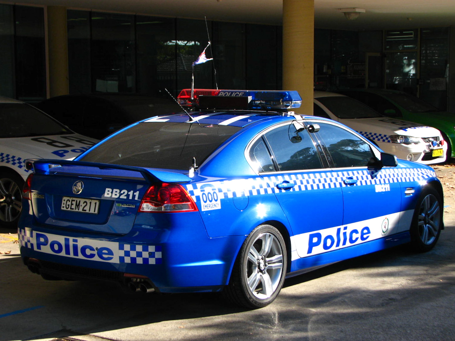 a police car parked in front of a building