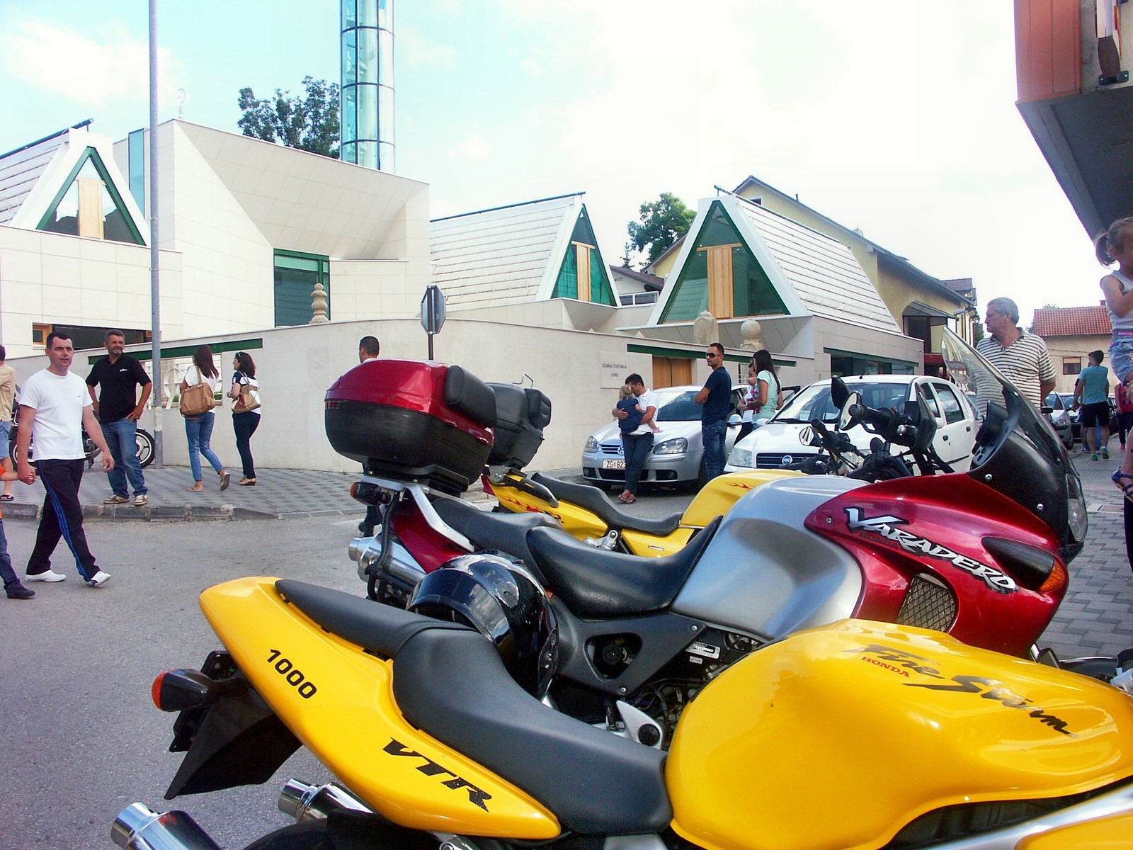 two motorcycles are sitting next to each other