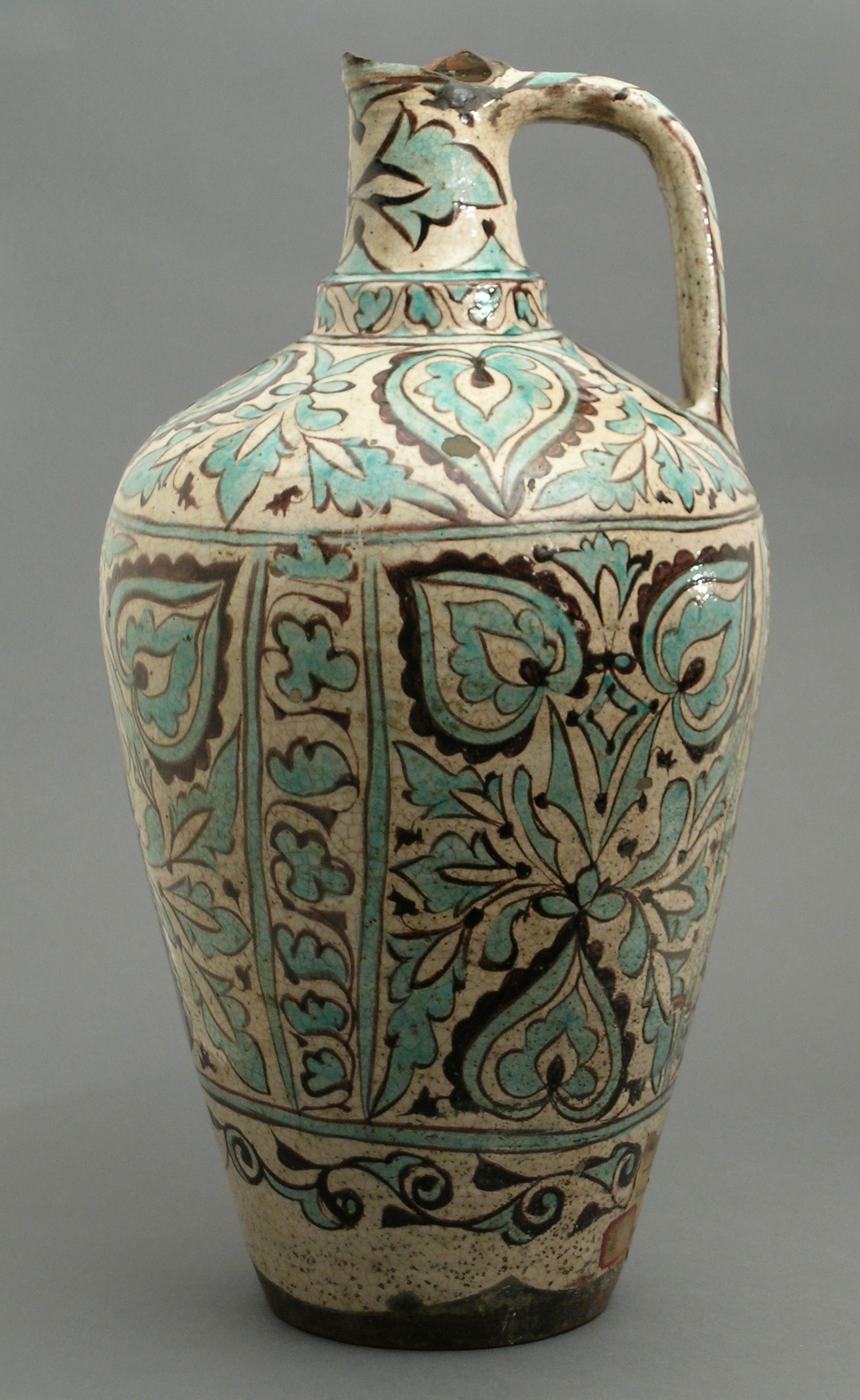 a vase is painted with ornate design on it