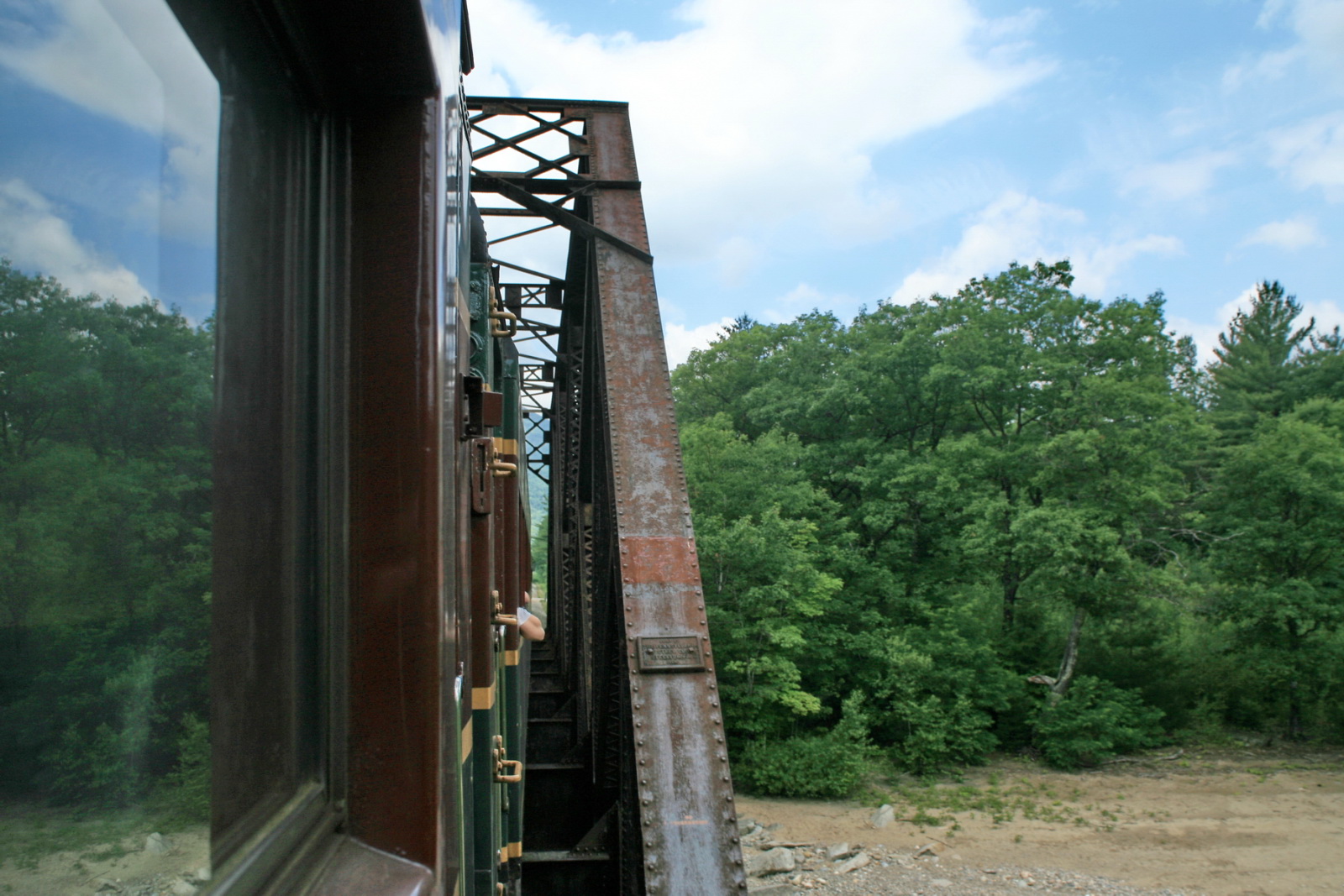 view from a train as it approaches a bridge