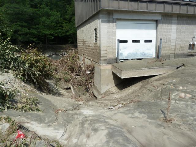 a white garage and a white fire hydrant in an empty area