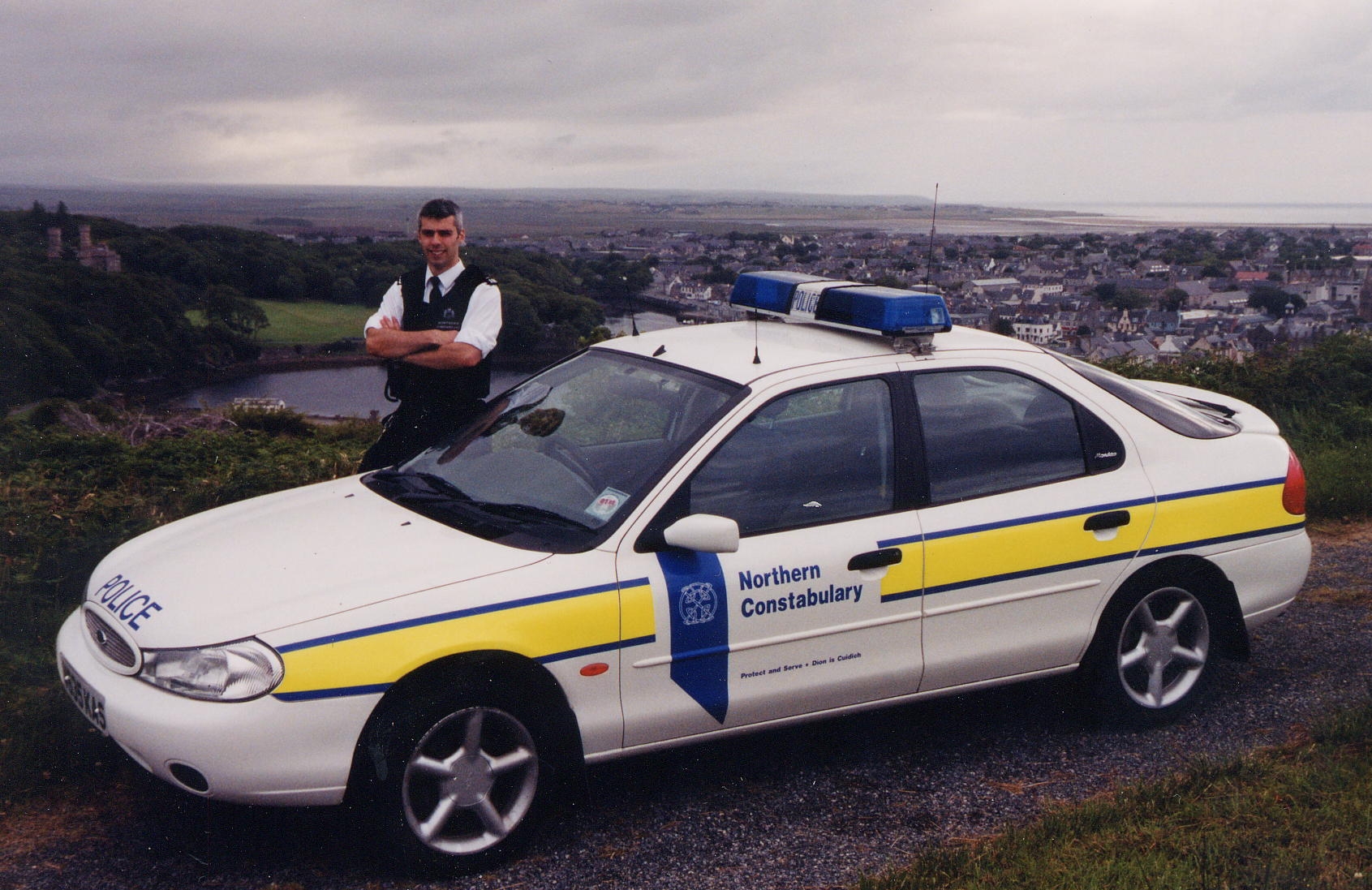 a white police car with the words victoria ambulance written on it