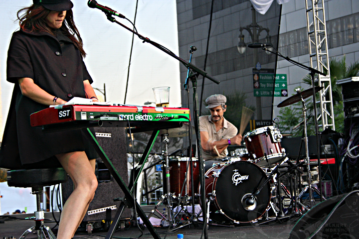 a musician plays with a keyboard on the street