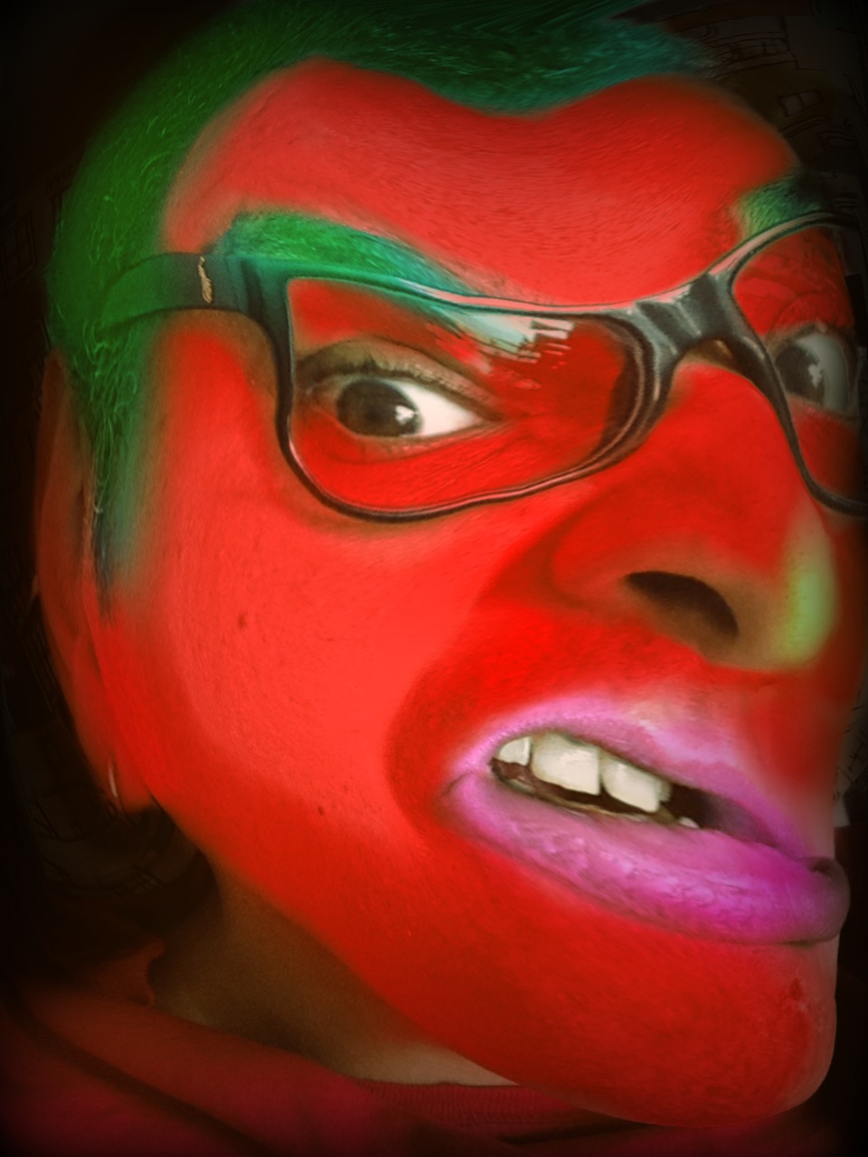 an image of a man that has painted his face green and red