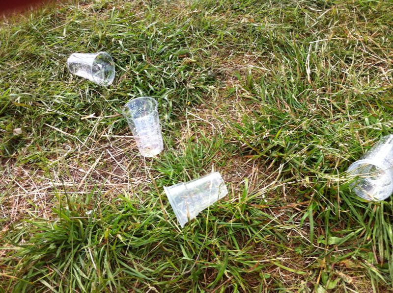 empty bottled water bottles lay on the ground
