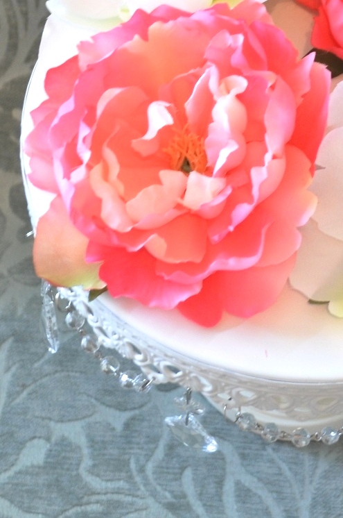 a cake that has been decorated with flowers on top