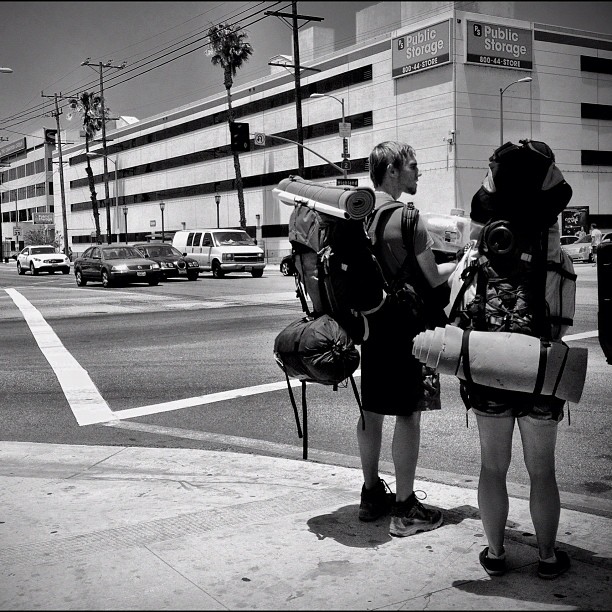 a black and white po of two women with luggage