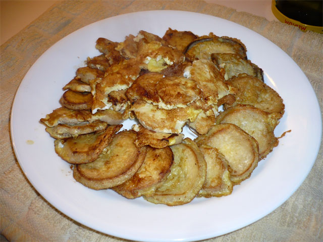 a plate with some fried food on it