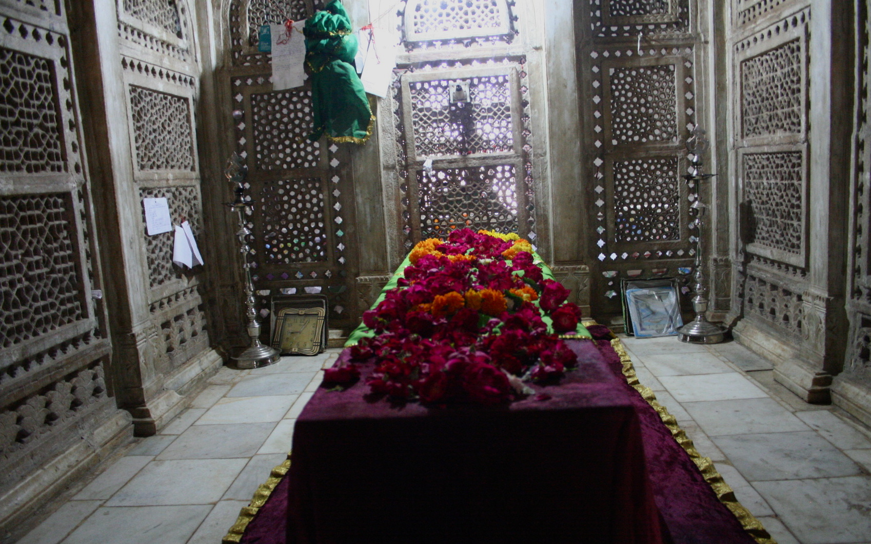 a vase with flowers in it on a altar