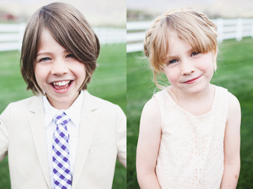 two children are dressed in dress clothes smiling