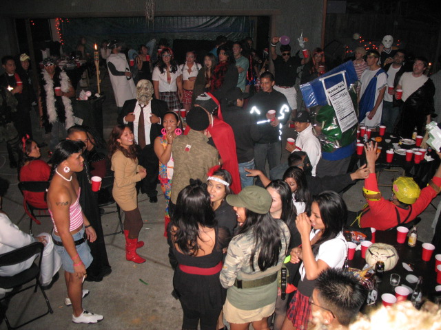 people gathered in an indoor area in costumes