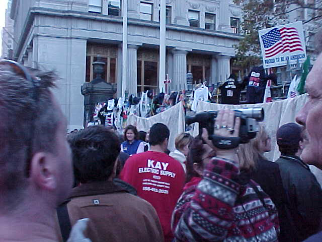 a crowd of people walking on the street