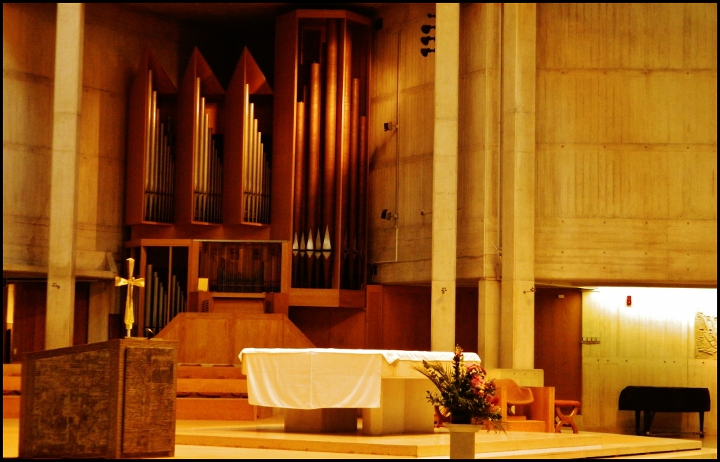 a church with lots of wooden organ pipes