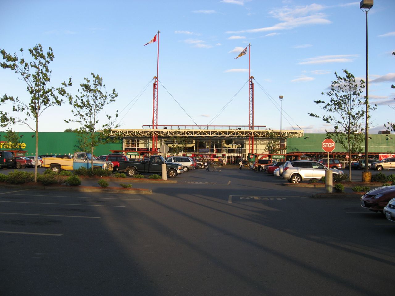 a parking lot at a mall full of cars