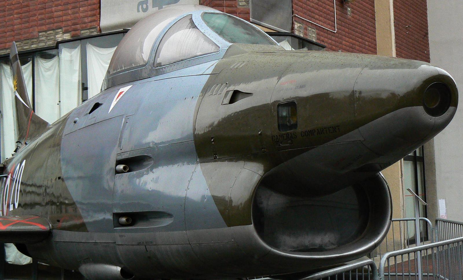 a military aircraft with a nose is on display