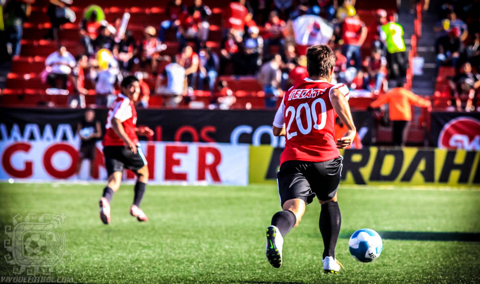a soccer player is playing on the field