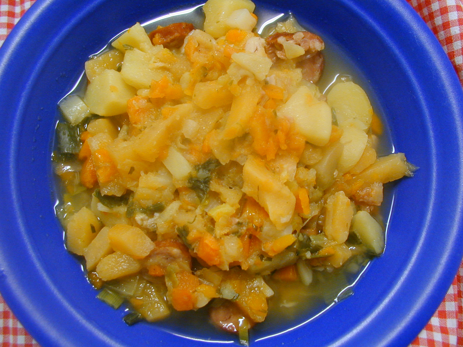 an image of a stew with potatoes and carrots in a bowl