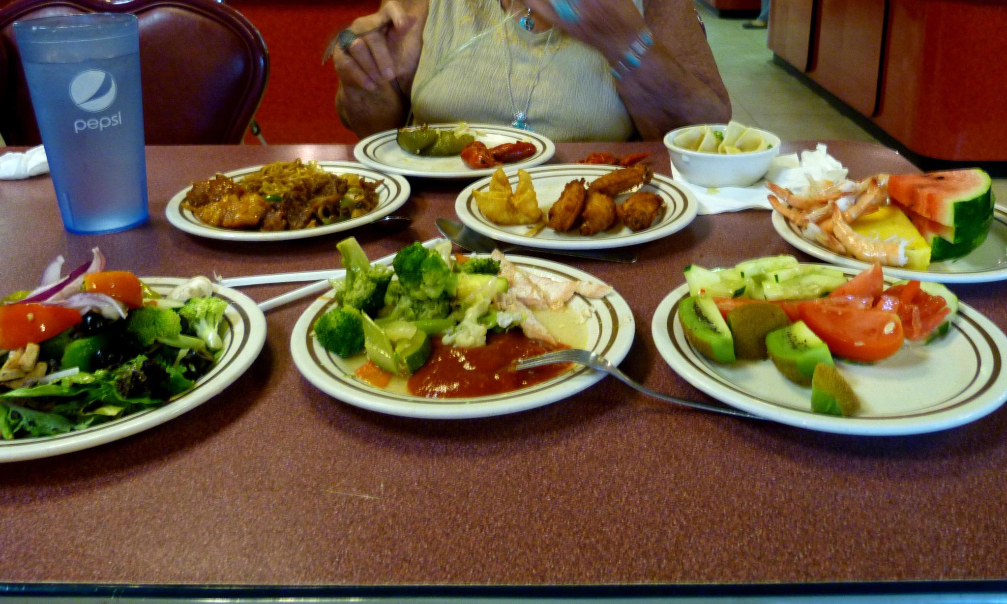 plates of different foods sit on a table