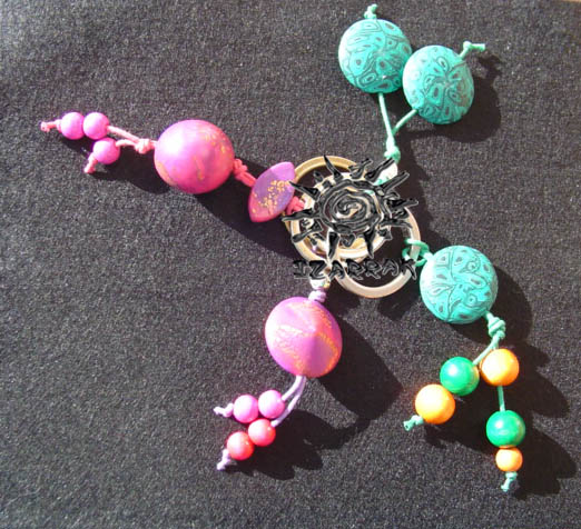 a couple of celets with beads, attached to a lanyard