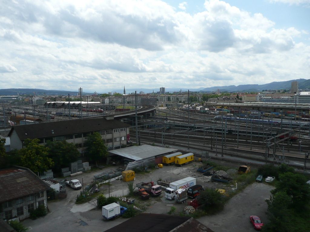 several cars are parked on the side of a road