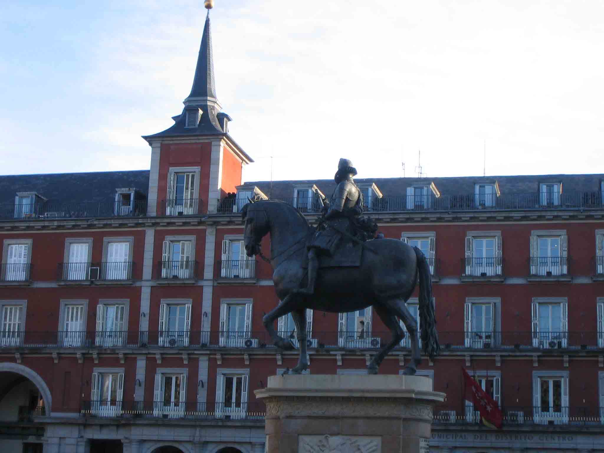 a statue of a man riding on top of a horse