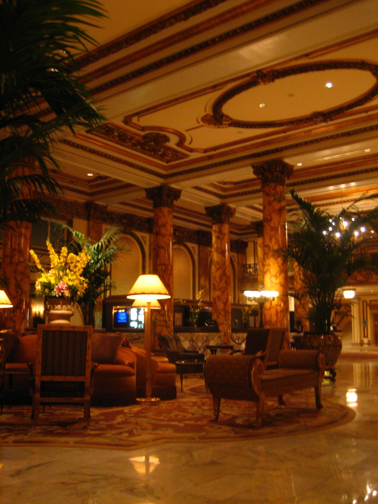 the large lobby has couches, chairs, and lamps